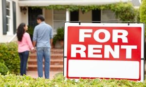 Hispanic couple outside home for rent